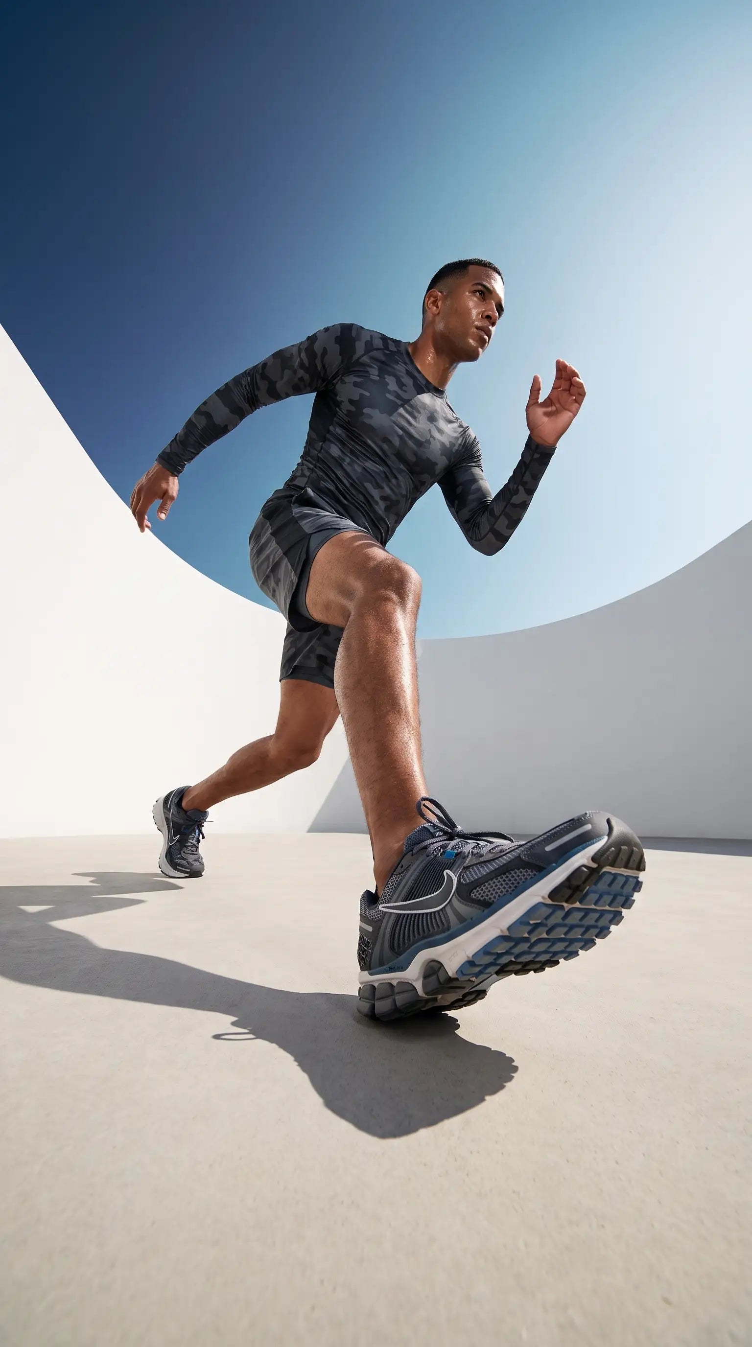Men's upf 50 long sleeve compression rash guard with a runner in action during outdoor training.