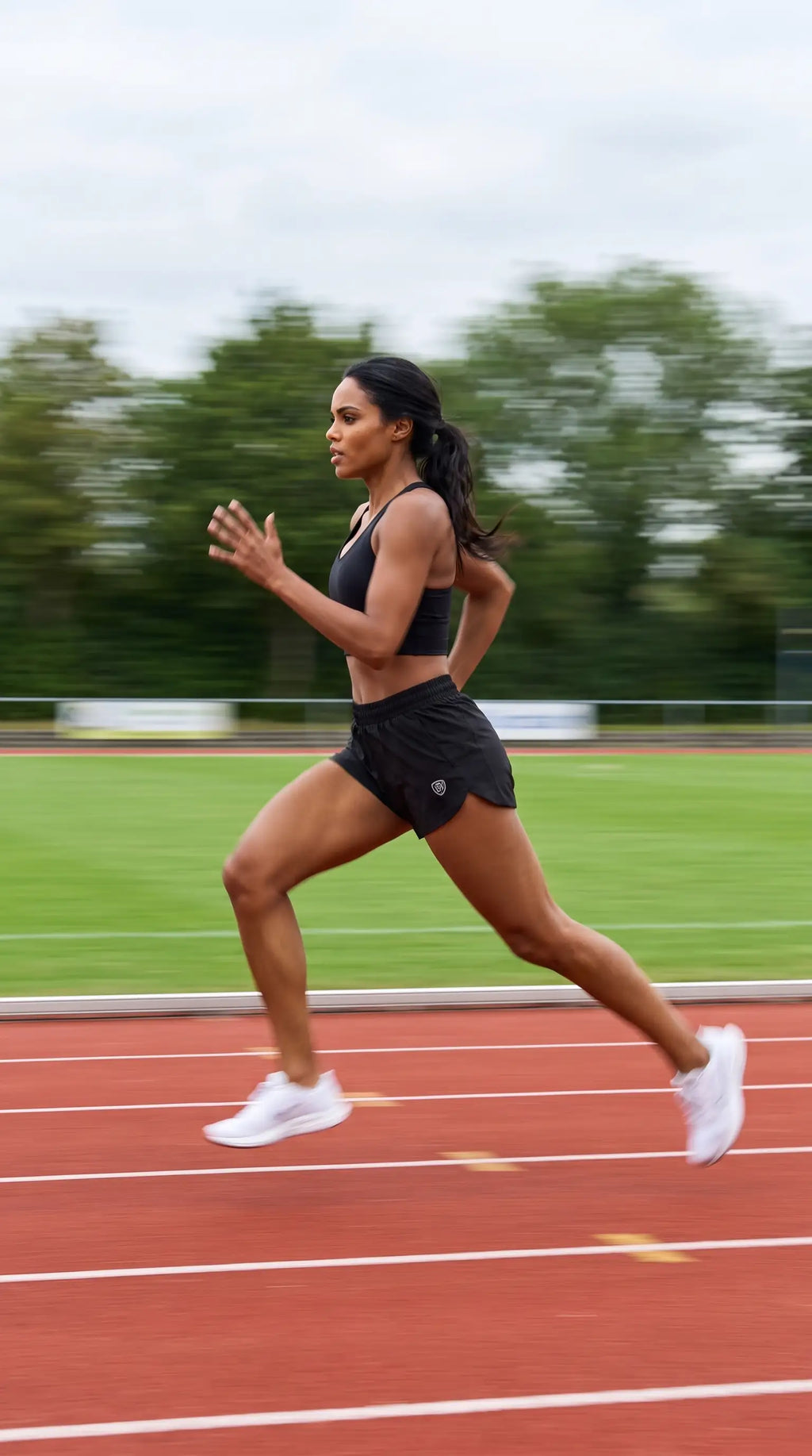 Excel Women’s Workout Shorts Premium Stretch Training Shorts for Women, athlete running on track with confidence and style.