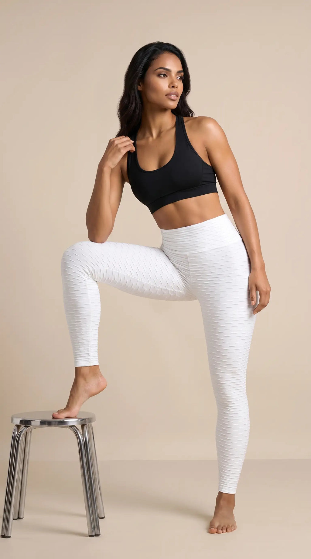 Model wearing Women's Seamless Bubble Leggings and a black sports bra, showcasing the textured design and high-waist fit.