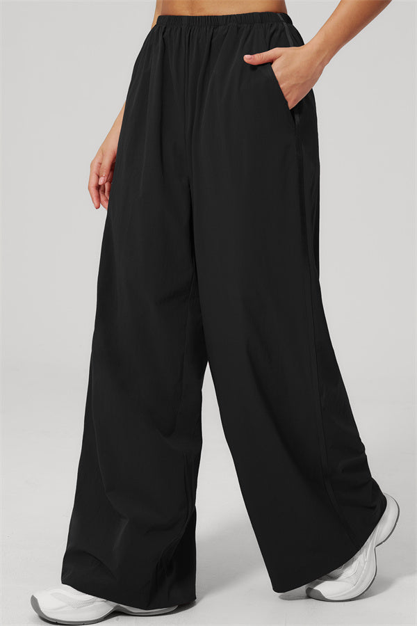 The Spunk UV protection Jacket Sweatpants 2-Piece Set featuring black sweatpants with pockets and a relaxed fit.