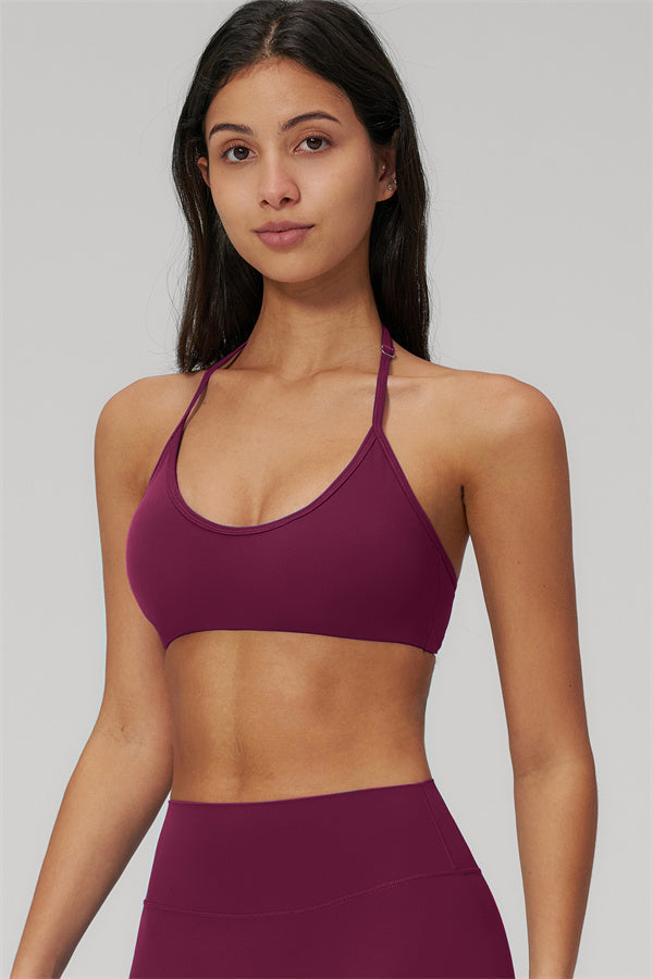 The Rapture Sports Bra Leggings 2-Piece Set featuring a sleek halter neckline sports bra in burgundy color.