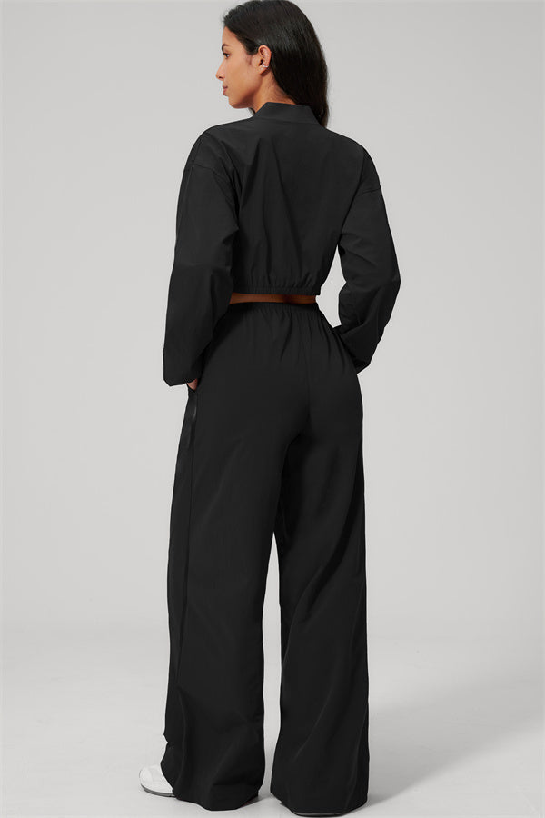 The Spunk UV protection Jacket Sweatpants 2-Piece Set showcased from the back, featuring a relaxed sporty silhouette with a modern look.