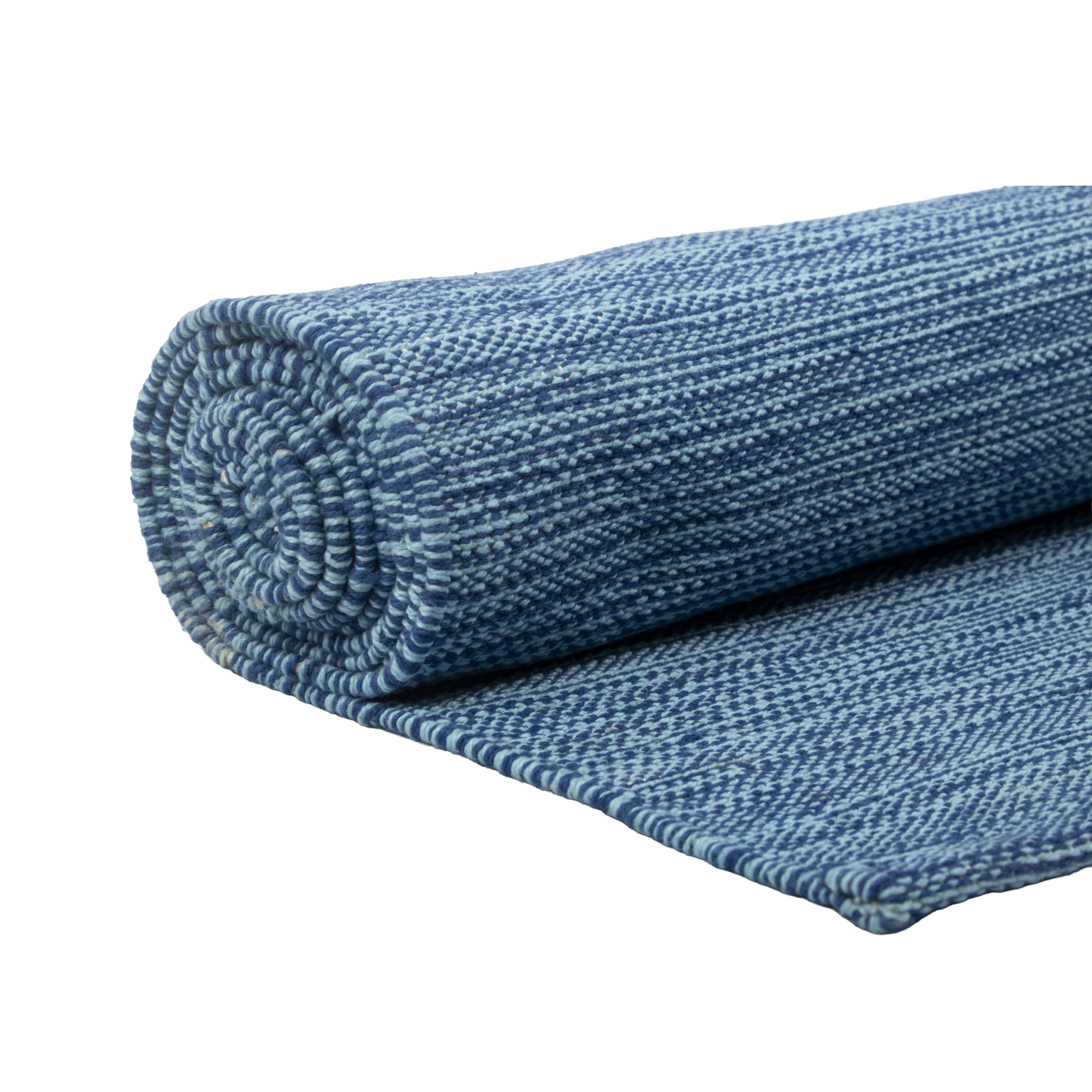 THE YOGI ORGANIC COTTON YOGA MAT rolled up, showcasing its beautiful blue pattern and eco-friendly material.