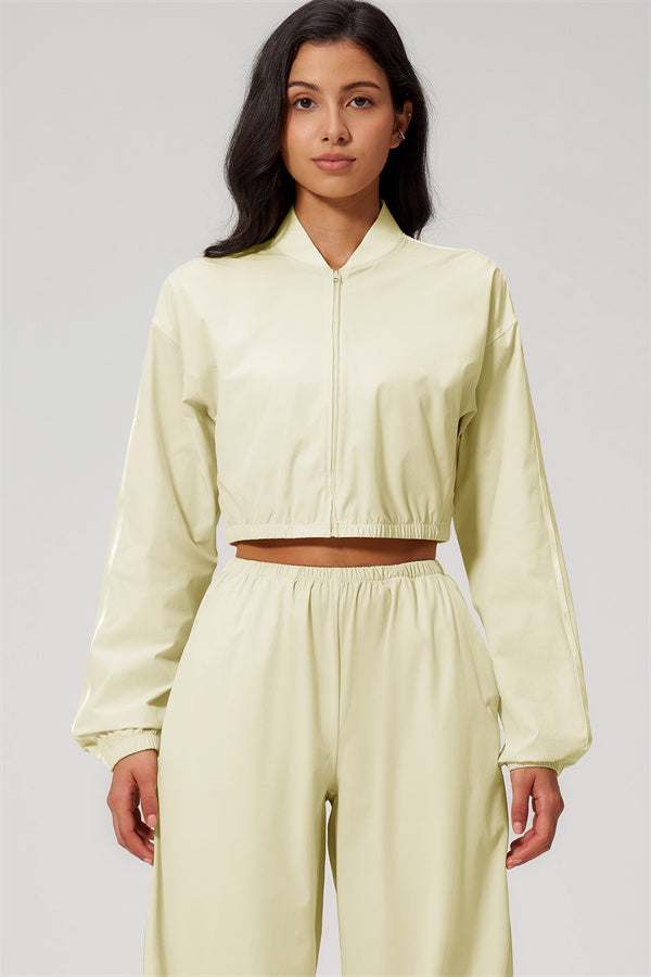 Model wearing The Spunk UV protection Jacket Sweatpants 2-Piece Set in light yellow, showcasing stylish, sun-protective activewear.