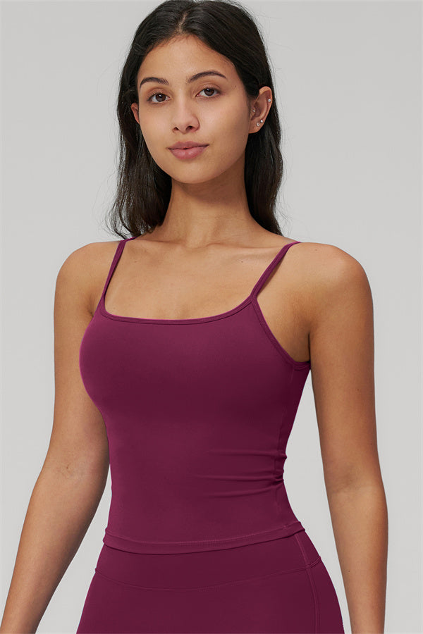 The Rapture Tank Top Flared Leggings 2-Piece Set featuring a stylish model in a burgundy tank top.