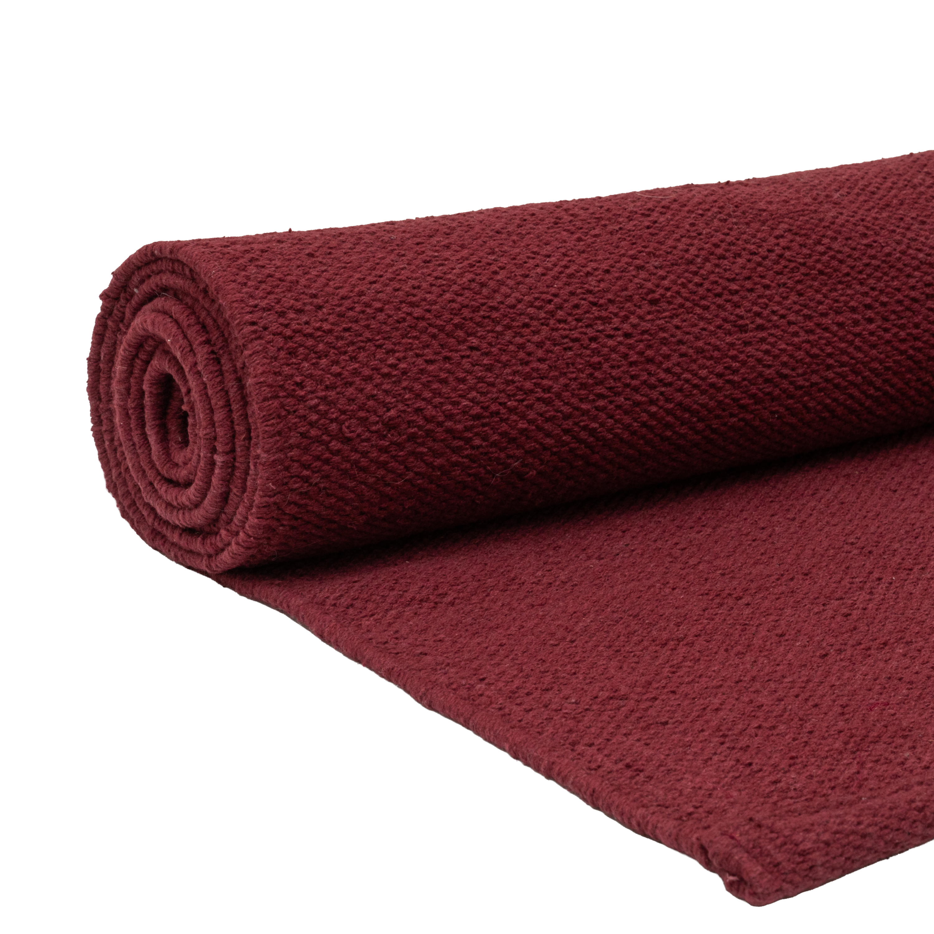 THE YOGI ORGANIC COTTON YOGA MAT rolled up in a deep burgundy color, showcasing its soft and eco-friendly texture.