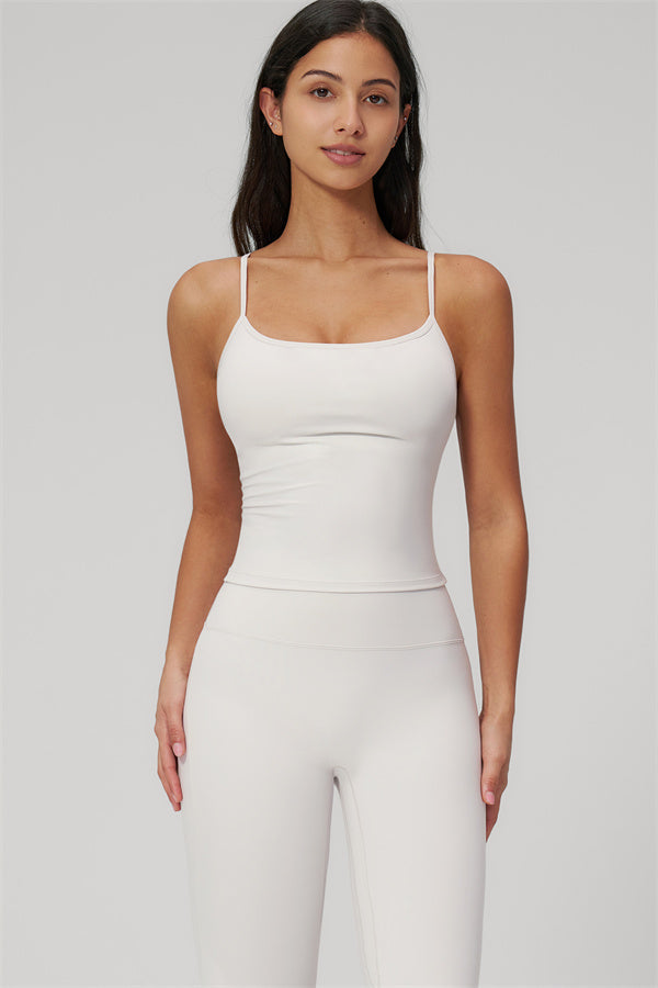 Model wearing The Rapture Tank Top Flared Leggings 2-Piece Set in white, showcasing elegant style and comfort.