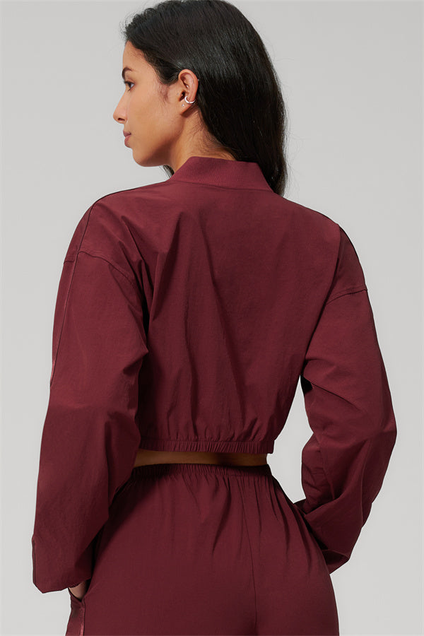 The Spunk UV protection Jacket Sweatpants 2-Piece Set showcasing a model wearing the jacket from the back in a burgundy color.