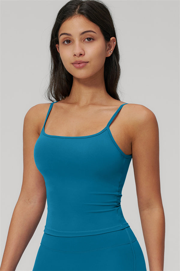 The Rapture Tank Top Flared Leggings 2-Piece Set model showcasing the tank top with straps in a vibrant teal color.