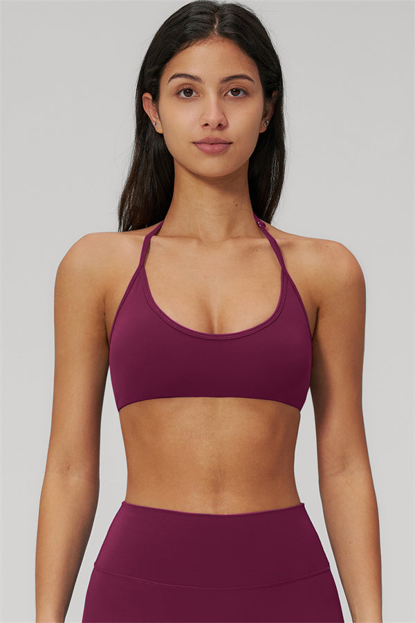 The Rapture Sports Bra Leggings 2-Piece Set featuring a stylish halter neckline sports bra in deep burgundy.