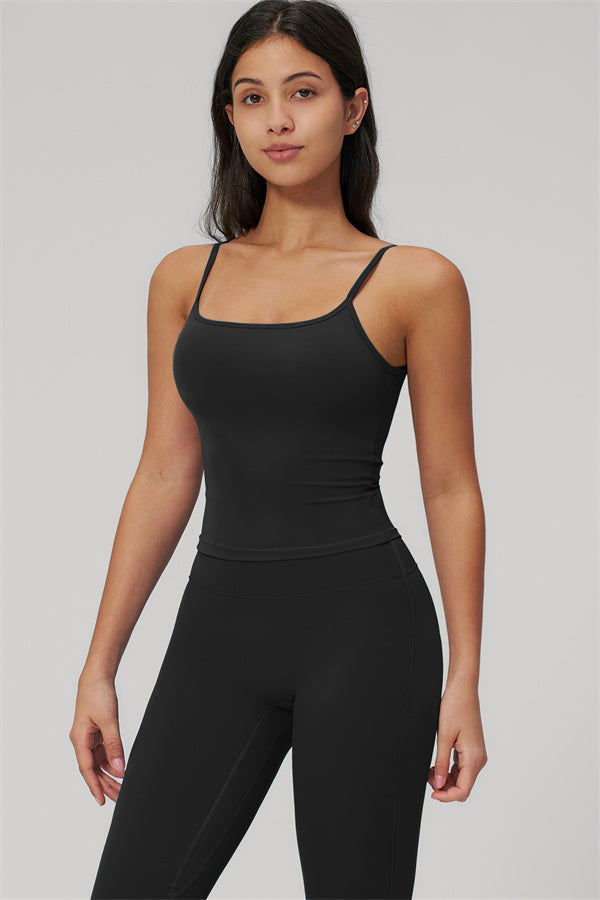 The Rapture Tank Top Flared Leggings 2-Piece Set featuring a model in a black tank and leggings.
