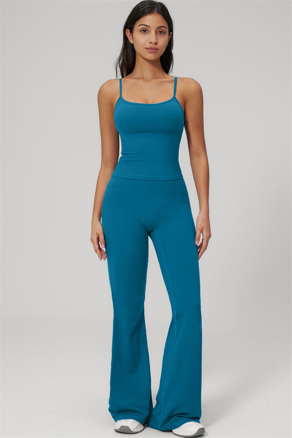 Model wearing The Rapture Tank Top Flared Leggings 2-Piece Set in teal, showcasing stylish and comfortable activewear.