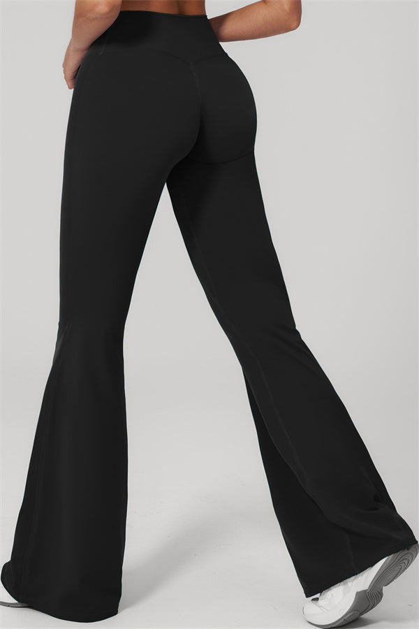 The Rapture Tank Top Flared Leggings 2-Piece Set featuring black flared leggings from the back view.