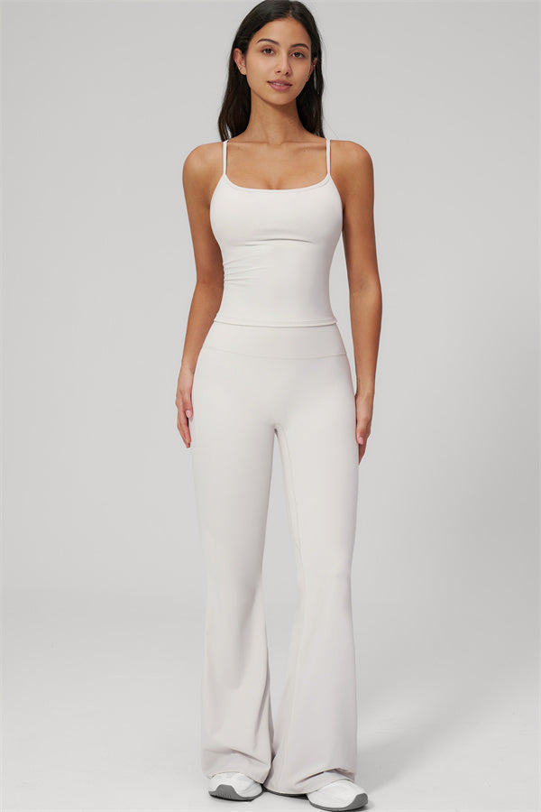 The Rapture Tank Top Flared Leggings 2-Piece Set model wearing a light-colored tank top and flared leggings.