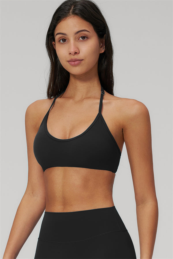 The Rapture Sports Bra Leggings 2-Piece Set featuring a sleek black sports bra with halter neckline.