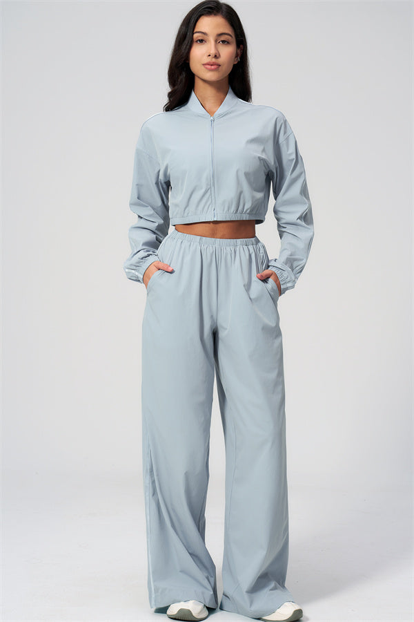 The Spunk UV protection Jacket Sweatpants 2-Piece Set model wearing light blue outfit, ideal for sun protection and layering.