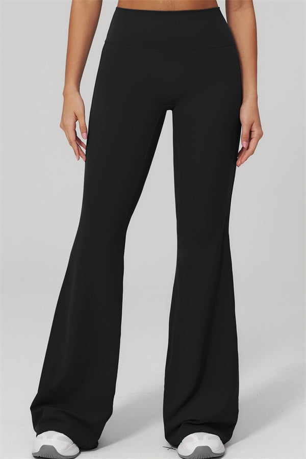Model wearing The Rapture Tank Top Flared Leggings 2-Piece Set black flared leggings.