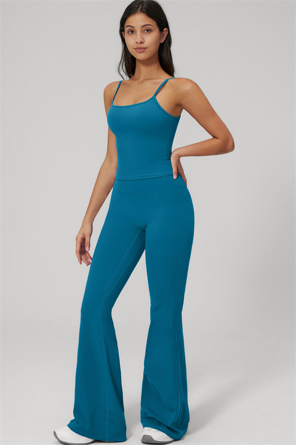 Model wearing The Rapture Tank Top Flared Leggings 2-Piece Set in blue against a plain background.