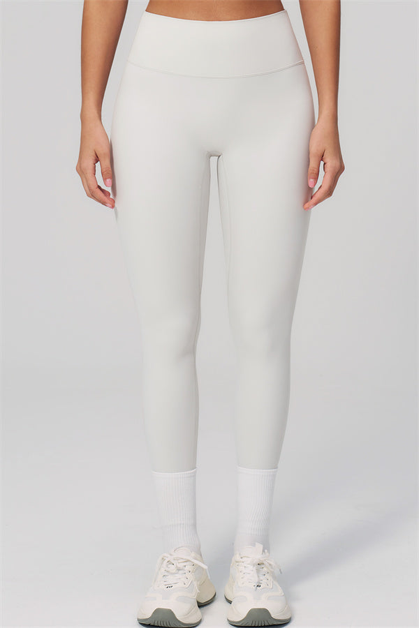 The Rapture Sports Bra Leggings 2-Piece Set featuring high-waisted leggings in a sleek white design.