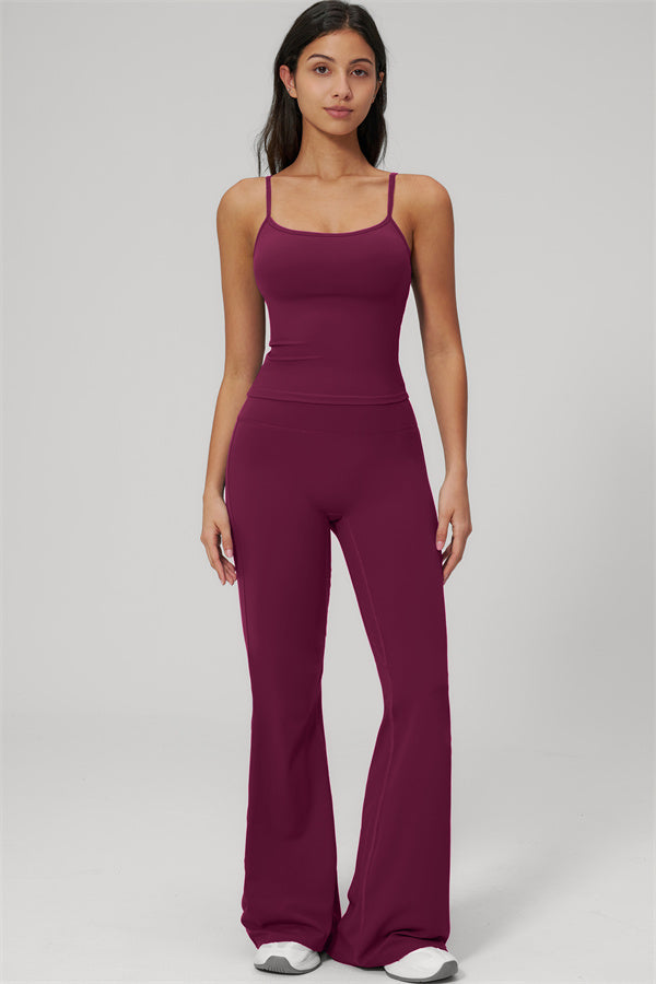 The Rapture Tank Top Flared Leggings 2-Piece Set in burgundy worn by a model showcasing the stylish flared design.