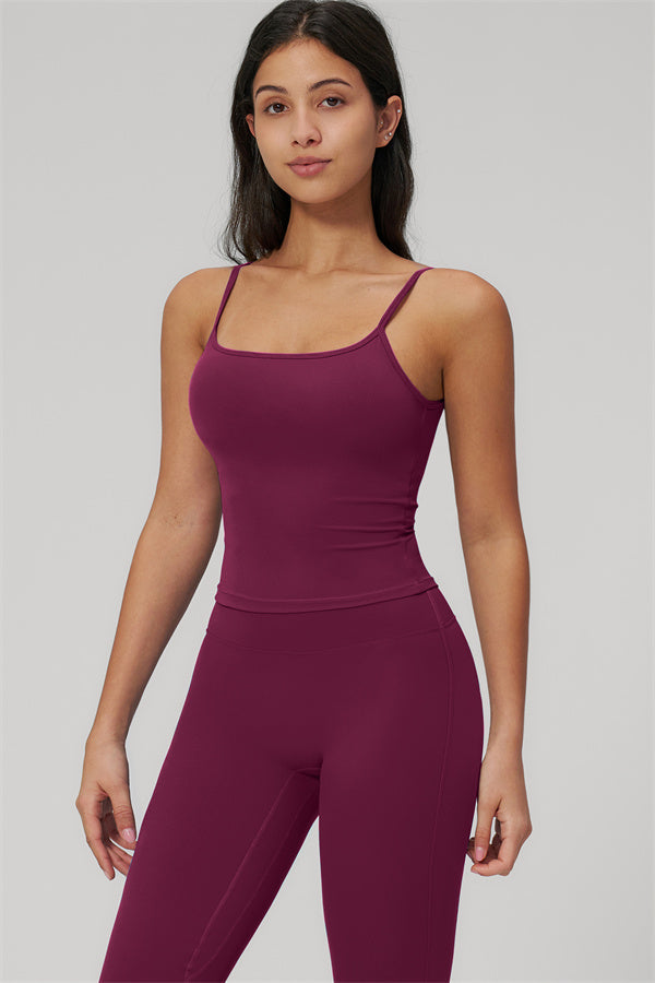 The Rapture Tank Top Flared Leggings 2-Piece Set model wearing a maroon tank top and leggings.