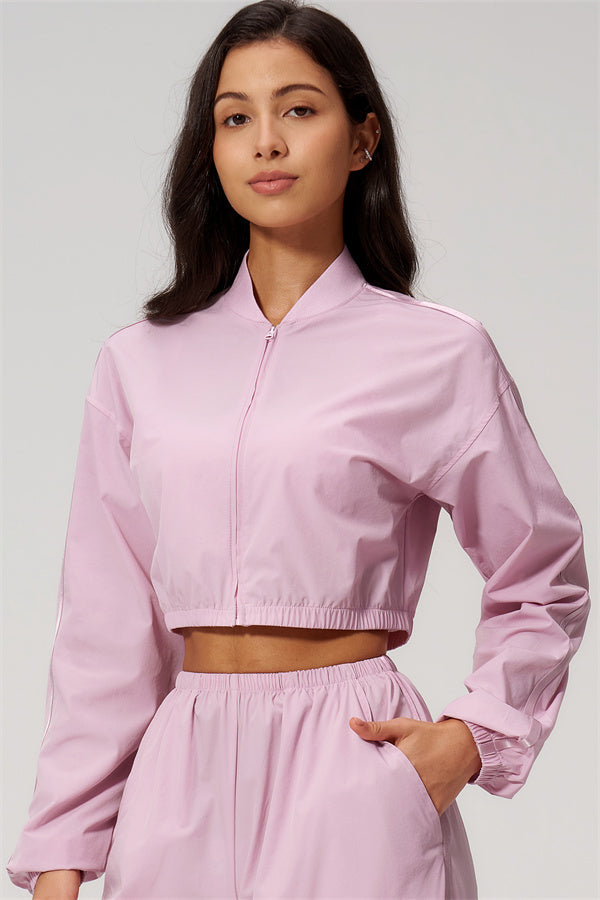 The Spunk UV protection Jacket Sweatpants 2-Piece Set in pink featuring a cropped style jacket with sporty design.