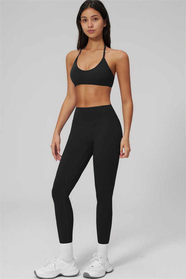 The Rapture Sports Bra Leggings 2-Piece Set featuring a halter sports bra and high-waisted leggings in black.
