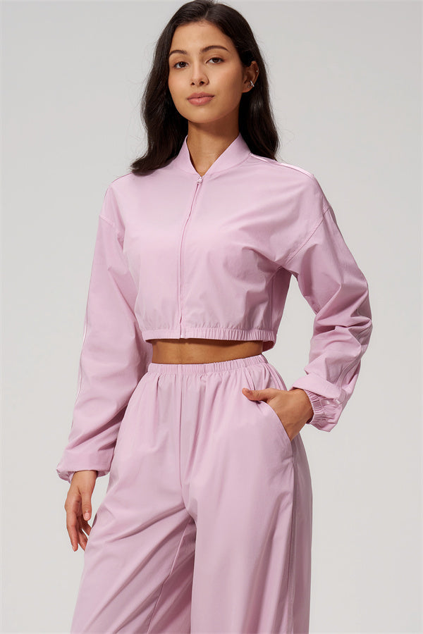The Spunk UV protection Jacket Sweatpants 2-Piece Set shown in pink, featuring a cropped jacket and relaxed sweatpants for stylish comfort.