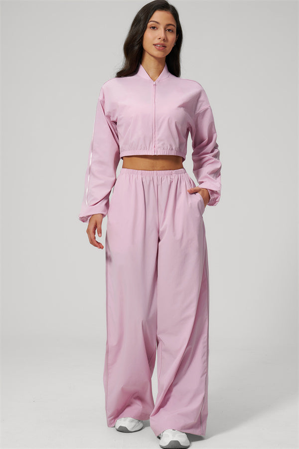 The Spunk UV protection Jacket Sweatpants 2-Piece Set in pink, featuring a relaxed sporty silhouette and cooling stretch fabric.