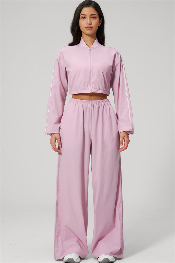 The Spunk UV protection Jacket Sweatpants 2-Piece Set in pink, featuring relaxed sporty silhouette and comfortable fit.