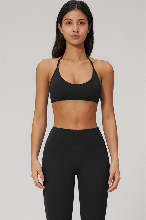 The Rapture Sports Bra Leggings 2-Piece Set model wearing a black sports bra and high-waisted leggings.