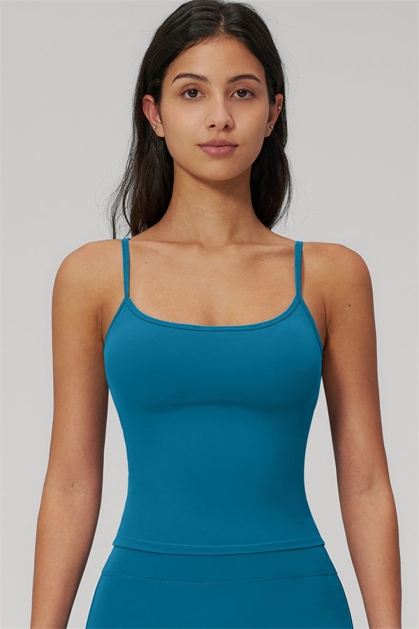 Model wearing The Rapture Tank Top Flared Leggings 2-Piece Set in teal color, showcasing the tank top style.