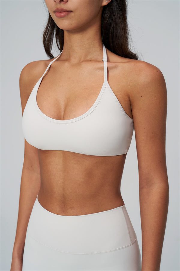 The Rapture Sports Bra Leggings 2-Piece Set showcasing the sleek halter sports bra design in a light color.