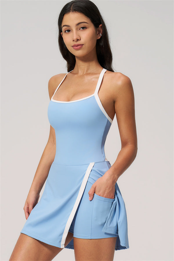 The New High End Spunk Tennis Dress displayed in light blue fabric, featuring a stylish design with a pocket.