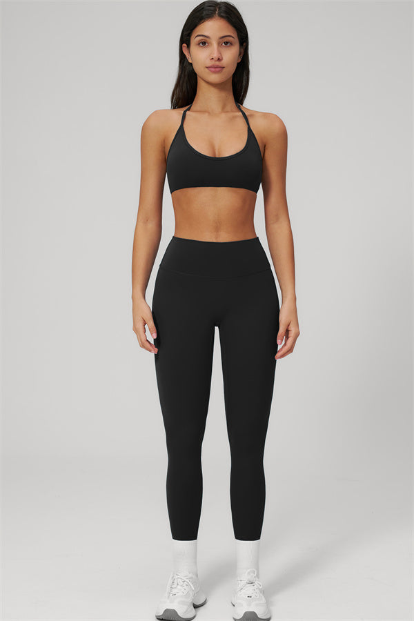The Rapture Sports Bra Leggings 2-Piece Set modeled by a woman in black sports bra and high-waisted leggings.