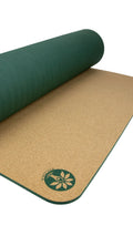 The New Premium Aura Cork Yoga Mat demonstrating a green rolled-up yoga mat with a cork surface.