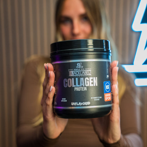BLACKLABEL COLLAGEN PROTEIN SUPPLEMENT in a black container held by a woman against a modern backdrop.