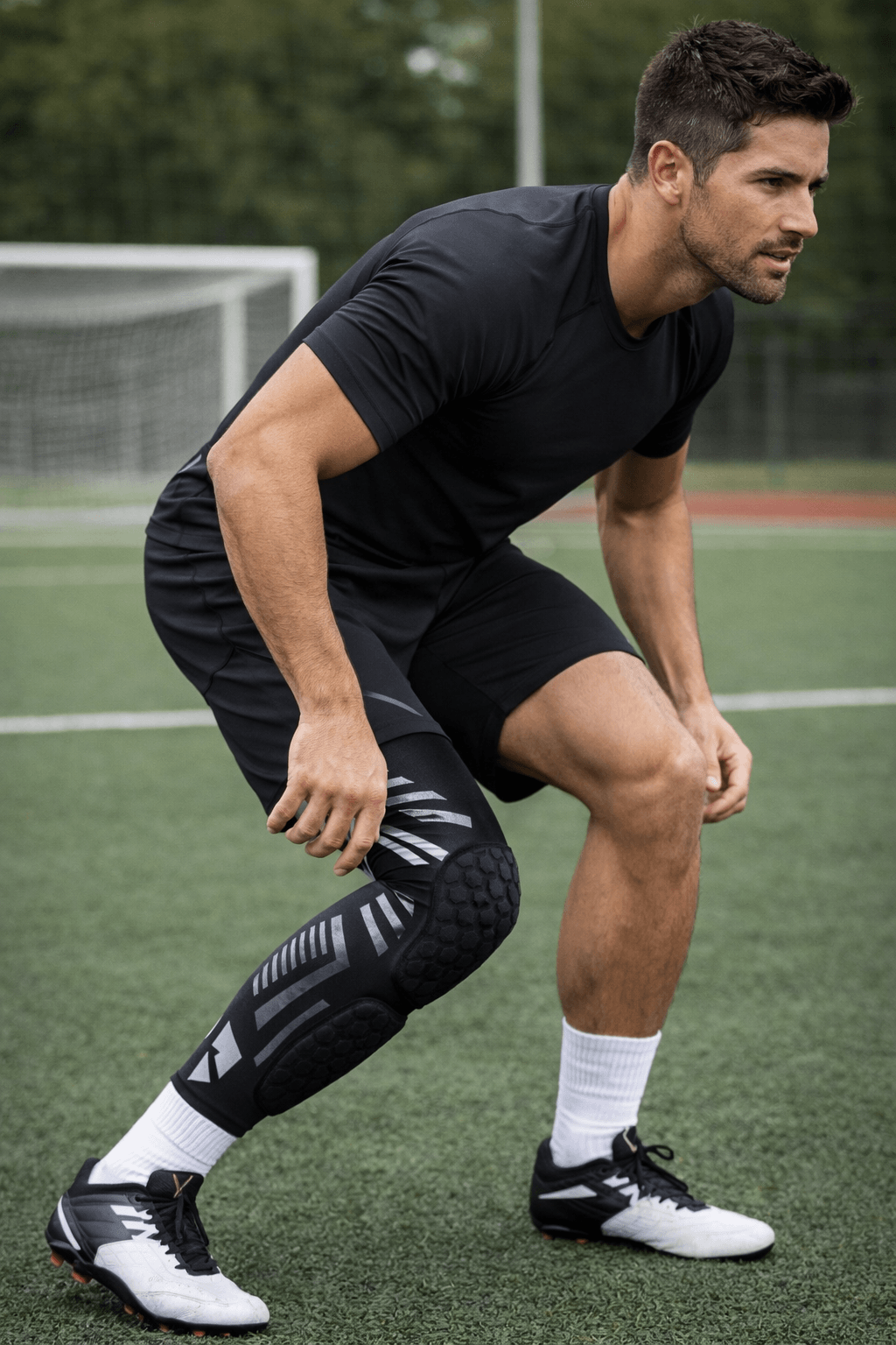 Padded Compression Leg Sleeve – Knee & Shin Protection for Sports & Training worn by an athlete on a sports field.