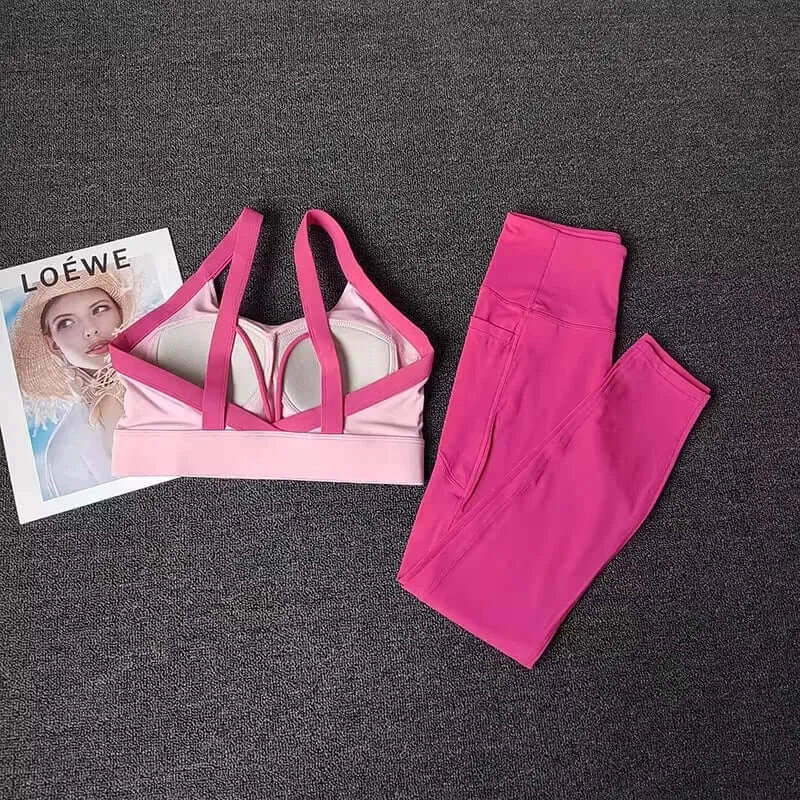 Women’s High-End Yoga Workout Set Pink sports bra and leggings set on a dark surface with a Loewe magazine