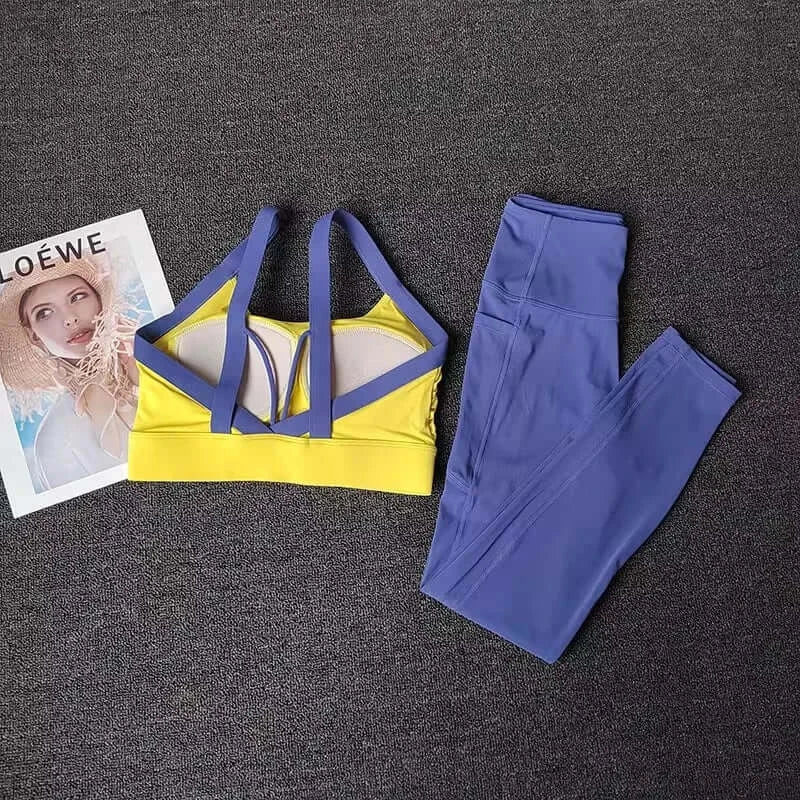 Women’s High-End Yoga Workout Set Yellow sports bra with blue straps and matching leggings on a dark surface.