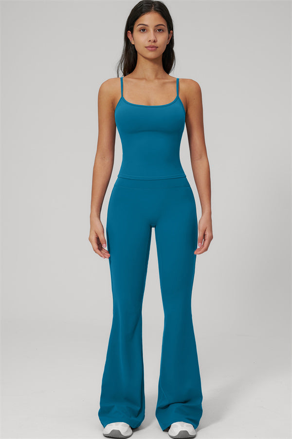 Model wearing The Rapture Tank Top Flared Leggings 2-Piece Set in teal color, showcasing a stylish and comfortable outfit.