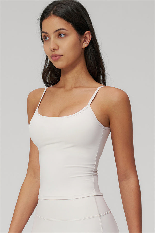 Model wearing The Rapture Tank Top Flared Leggings 2-Piece Set in a light color, showcasing the tank top style.