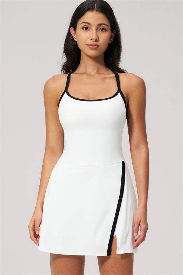 Model wearing The New High End Spunk Tennis Dress featuring a sleek design and stylish cut.