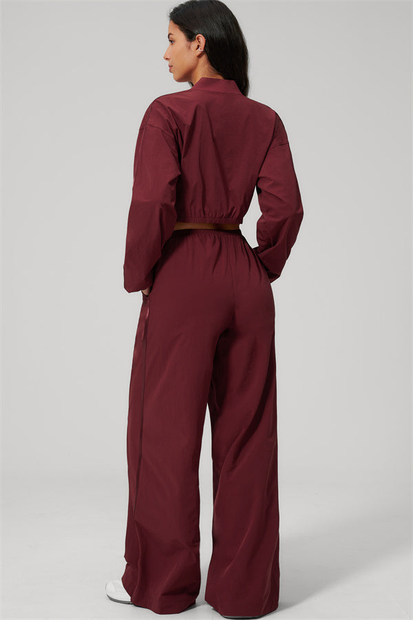 Back view of The Spunk UV protection Jacket Sweatpants 2-Piece Set in burgundy color showcasing its relaxed fit and sporty style.