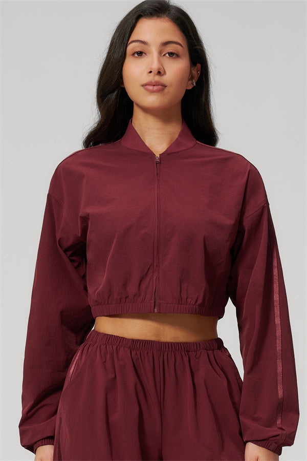 The Spunk UV protection Jacket Sweatpants 2-Piece Set featuring a model in a burgundy cropped jacket.