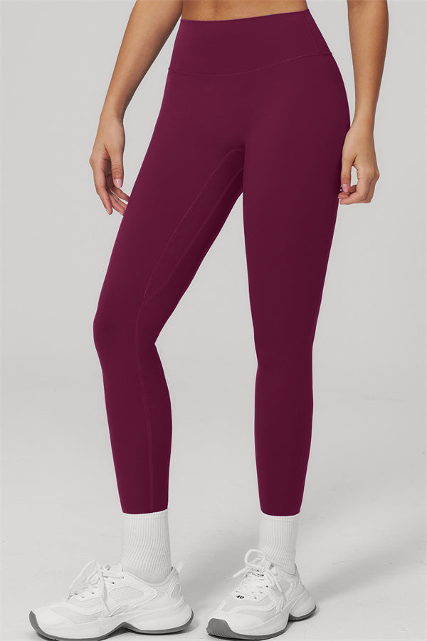 The Rapture Sports Bra Leggings 2-Piece Set featuring high-waisted leggings in a rich burgundy color.