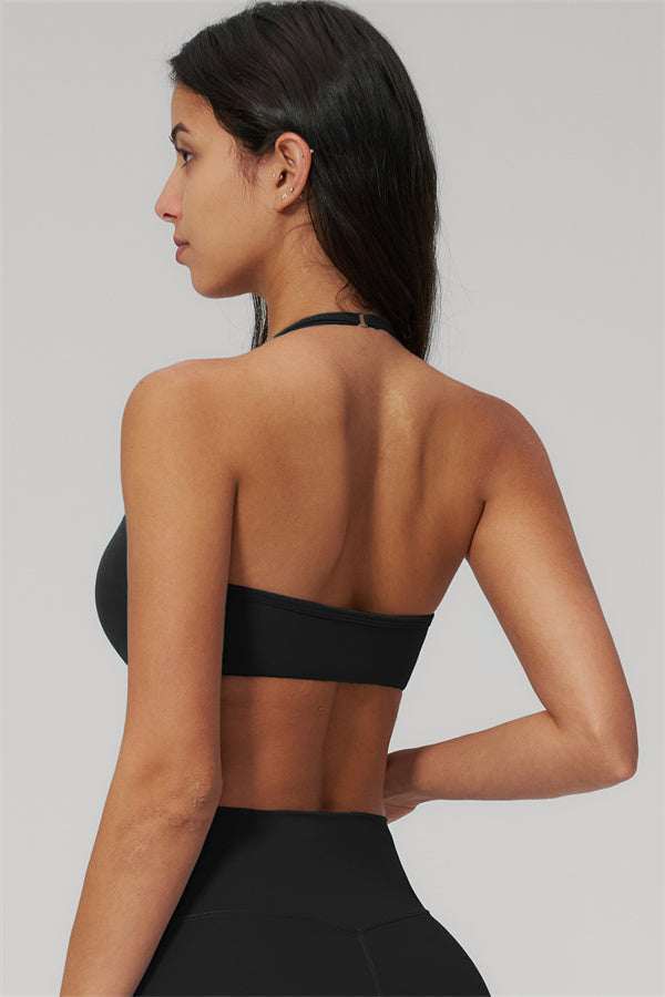 Model showcasing the back view of The Rapture Sports Bra Leggings 2-Piece Set in black.