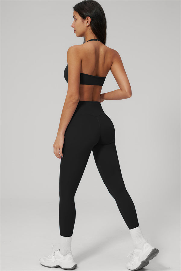 The Rapture Sports Bra Leggings 2-Piece Set featuring a sleek black design, showing the back view of the model.