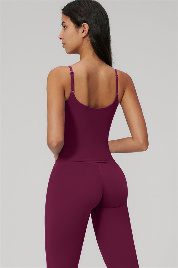 The Rapture Tank Top Flared Leggings 2-Piece Set worn by a model showcasing the back view in burgundy.