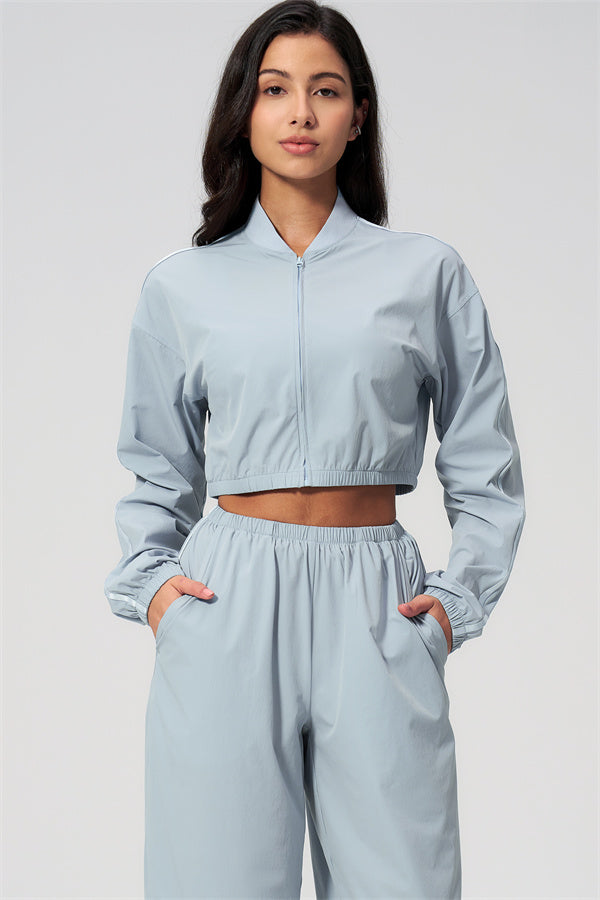 The Spunk UV protection Jacket Sweatpants 2-Piece Set featuring a cropped jacket and matching sweatpants in light blue.